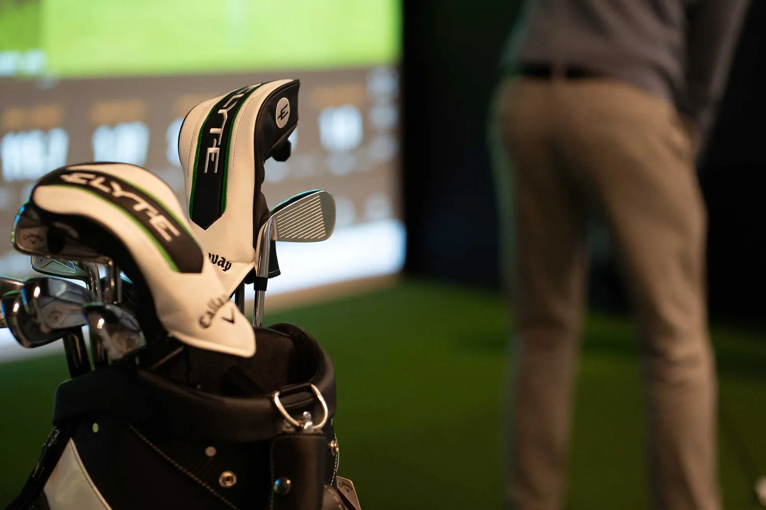 A member practising in a private Trackman bay at Grip Golf
